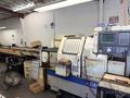 (2) Okuma LNC-8C CNC Lathe, OSP 700L Control, 12 Station Turret, Kitagawa B-08 3 Jaw Chuck, SMW Omnibar Bar Feeder