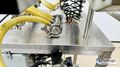 Inline Filling Systems  | Six-Headed Semi-Automatic  |  Overflow Filler