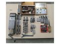 EQUIPPED WITH 4000 RPM, HEIDENHAIM TNC 125, SWISS MADE, LOTS OF TOOLING