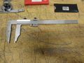 Etalon 14" Vernier Caliper, (2) Mitutoyo Protractors, Fowler 1" Travel Indicator, Mag Base Indicator Holder, SPI Radius and Surface Finish Gages- Auction Item