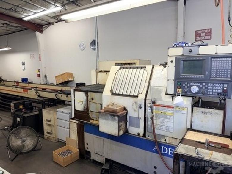(2) Okuma LNC-8C CNC Lathe, OSP 700L Control, 12 Station Turret, Kitagawa B-08 3 Jaw Chuck, SMW Omnibar Bar Feeder