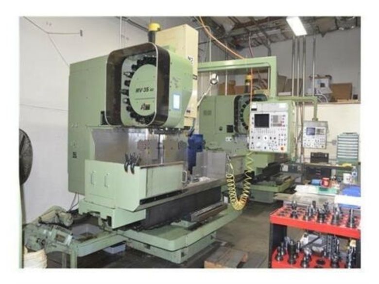 EQUIPPED WITH FANUC 6MB CONTROL, 6000 RPM, 10 HP, BT-40, 20 ATC, VISE & TOOL HOLDERS