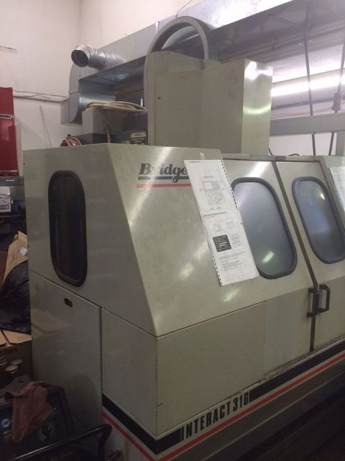 EQUIPPED WITH FANUC OM, 6000 RPM, 8 ATC, 40 TAPER, 18X12X18, ASSORTED COLLETS