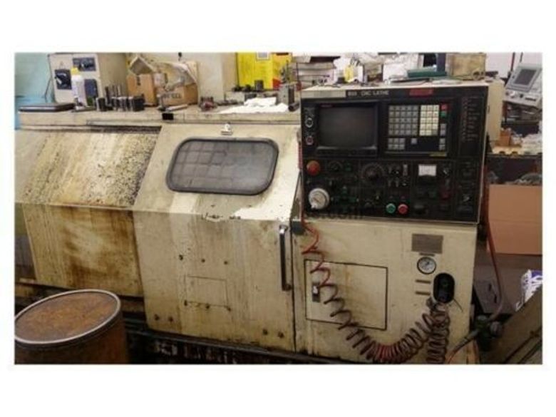 EQUIPPED WITH 4-AXIS, 22X60, FANUC 11TT, 4' SPINDLE HOLE, 15" CHUCK, COLLET HEAD, 60 HP, 3200 RPM, UNDER POWER & RUNNING