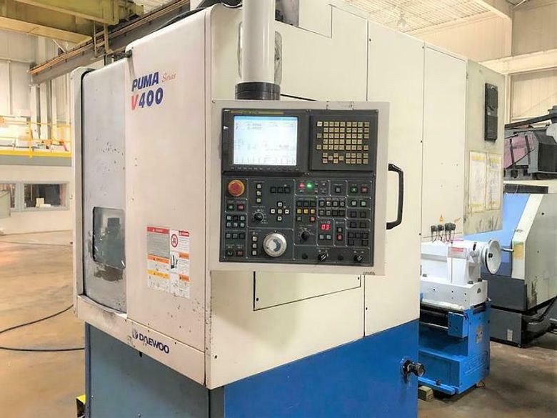 Daewoo Doosan V-400 Vertical Turret Lathe qty 2 available / . Fanuc 21iT Cnc Control . 15” Hyd. Chuck . 3000 Rpm . Chip Conveyor . Two exact machines available . Runs fine- No issues
