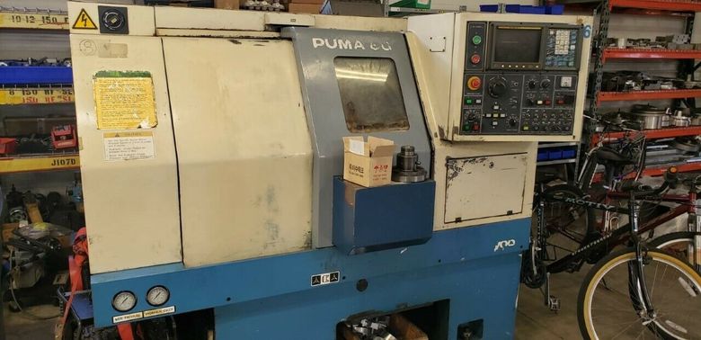 Box Way Machine 1996 DAEWOO PUMA 6G Fanuc OT GANG TOOL CNC LATHE, CHIP CONVEYOR, ASSORTED TOOLING ie fixtures and jaws  ($1000 value) /  not under power anymore but in excellent condition
