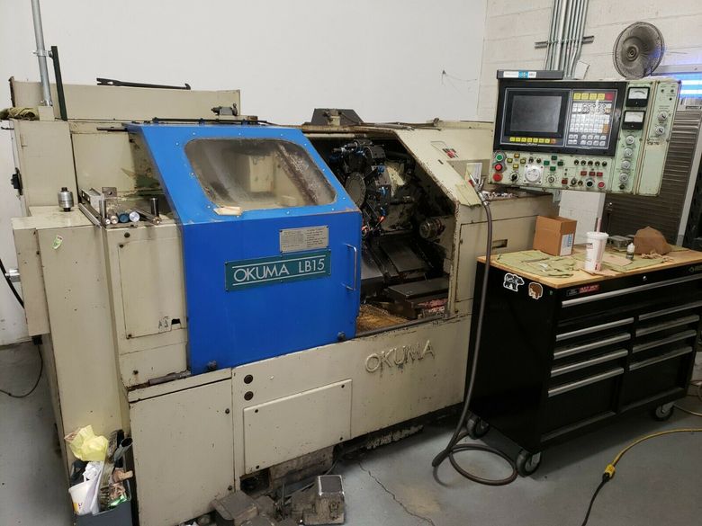 Okuma LB-15 CNC Lathe OSP5000L 8" Chuck 2.44 Bar Capacity