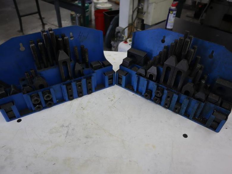 Clamp Down Hardware 1/2", (2) Partial Sets in Racks- Auction Item