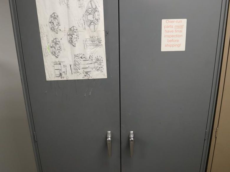 Steel 2 Door Cabinet with 7 Adjustable Shelves and Contents- Auction Item