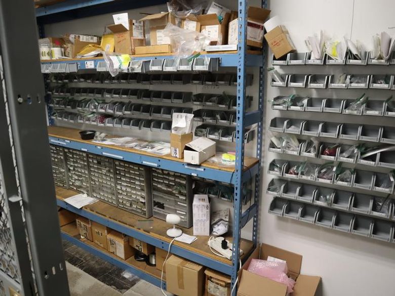 Wall with Teardrop Style Adjustable Racking 5 Shelves, and Mounted Bins with Contents, Hardware, Fasteners, Heli Coil Thread Inserts, and More- Auction Item