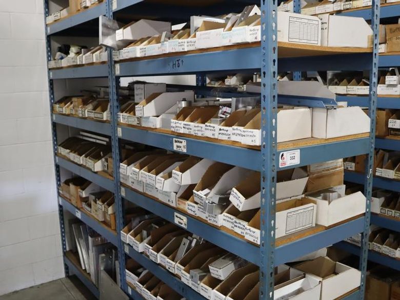 Teardrop Style Racking (2) 4' Sections, (15) Shelves,  with Contents of Mostly Aluminum Fixture Plates with Steel Hardware, And Tooling- Auction Item