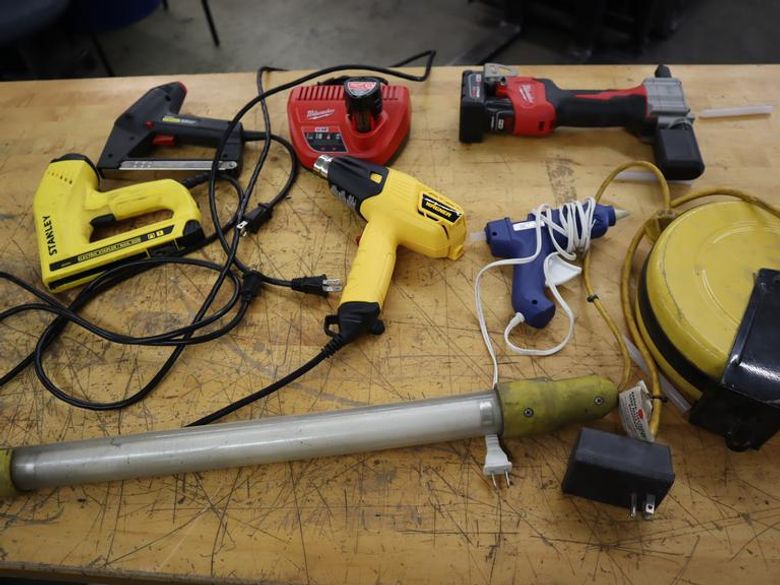 Milwuakee M12 Cordless Rivet Too., (2) Stanley Electric Staplers, Wagner Heat Gun, Extension Cord Reel, Glue Gun- Auction Item