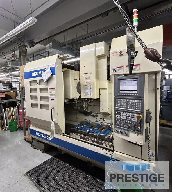 OKUMA MCV-4020, X-40", Y-20", OSP-E100M, 32 ATC, 4th Axis Ready, 15,000 RPM, CAT 40 Chip Conveyor, #43497