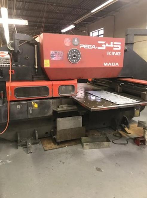 33 TON AMADA PEGA 345 KING TURRET PUNCH
W/ FANUC O4PC CNC CONTROL
MFG 1995