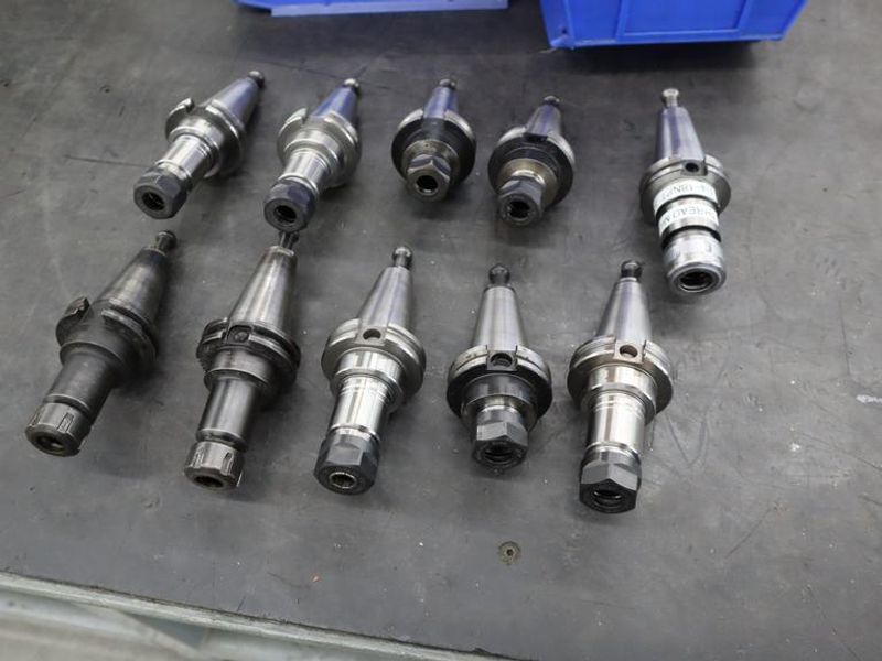 CT40 Taper Tool Holders: (9) Er20 Collet Holders, (1) Nikken SKN-16B Collet Holder- Auction Item