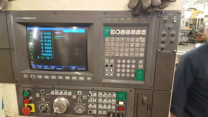 Model Okuma LU-45 25C x 1500 OSP7000L Control 21 Inch Chuck Conveyor