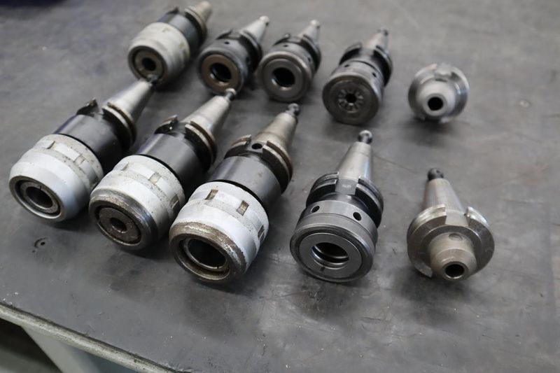 CT40 Taper Tool Holders: (4) Nikken KM-1 Collet Holders, (4) XCN-1000 Collet Holders, (1) End Mill Holder- Auction Item