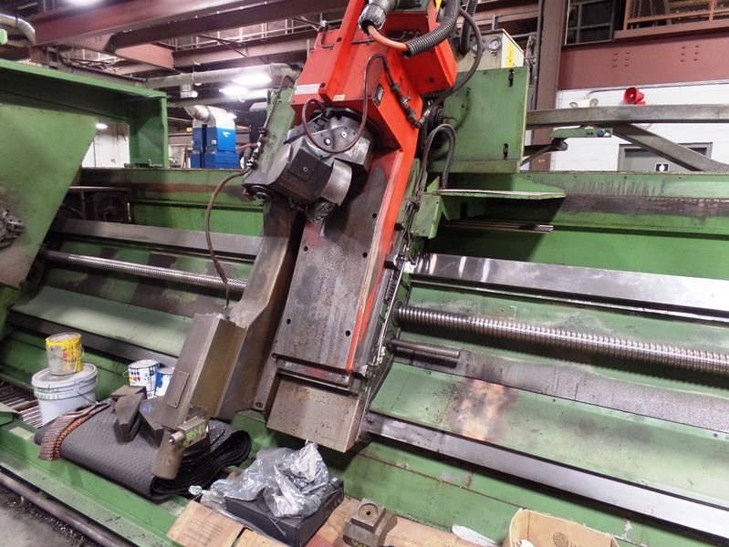Specifications:  Maximum part length  228”  Maximum machining length  212”  Spindle center height  49”  Cross slide stroke range 2´- 6”  Quill diameter  8.6”  Head degrees swivel angle  +/- 90’  Central lubrication Yes  Chip conveyor  Yes  Full encl