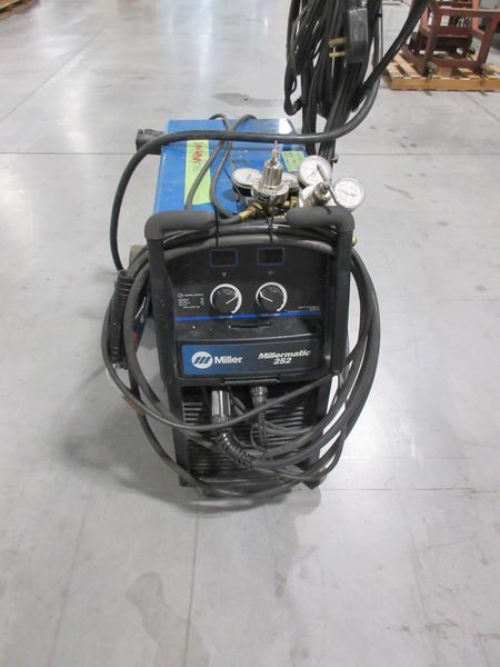 Millermatic 252 MIG Wire Feed Welder with Rolling Base and Accessories, 200/230V Single Phase- Auction Item