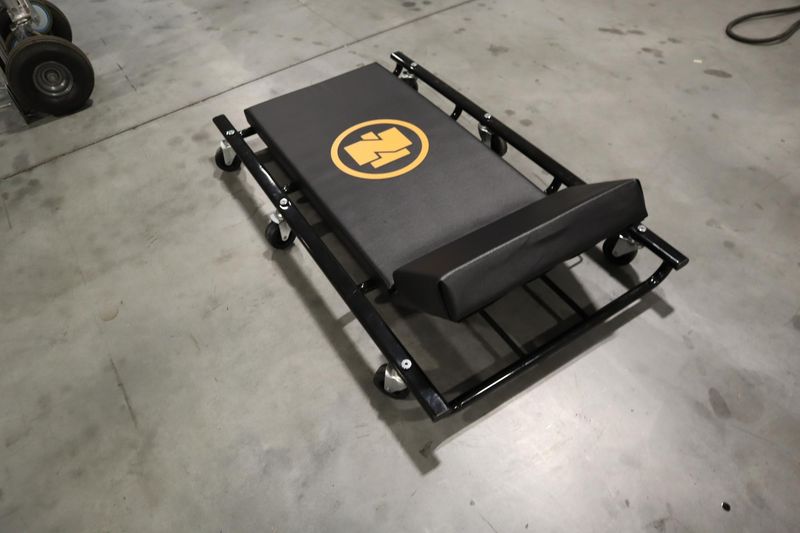 Northern Tool 44"L,  Wide Cushion Creeper with 6 Swivel Wheels and Adjustable Head Rest- Auction Item