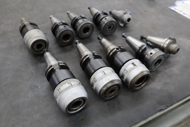 CT40 Taper Tool Holders: (4) Nikken KM-1 Collet Holders, (4) XCN-1000 Collet Holders, (1) End Mill Holder- Auction Item
