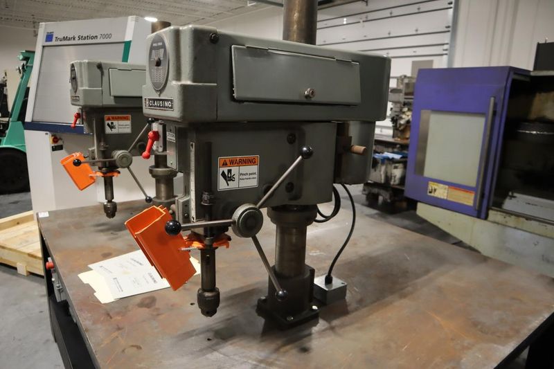 Clausing Model 2236 20" Drill Presses (2) on Steel Table, 2-Speed Motors, Hand Quill Feeds, Jacobs Drill Chucks, Safety Shields- Auction Item