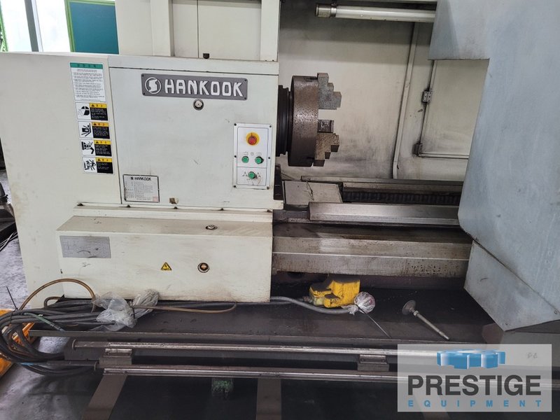 Hankook Hanturn-75 x 6000, 30" x 236", Fanuc 32i CNC, 18" Chuck, (2) Steady Rests, Chip Conveyor, 2012, #31904