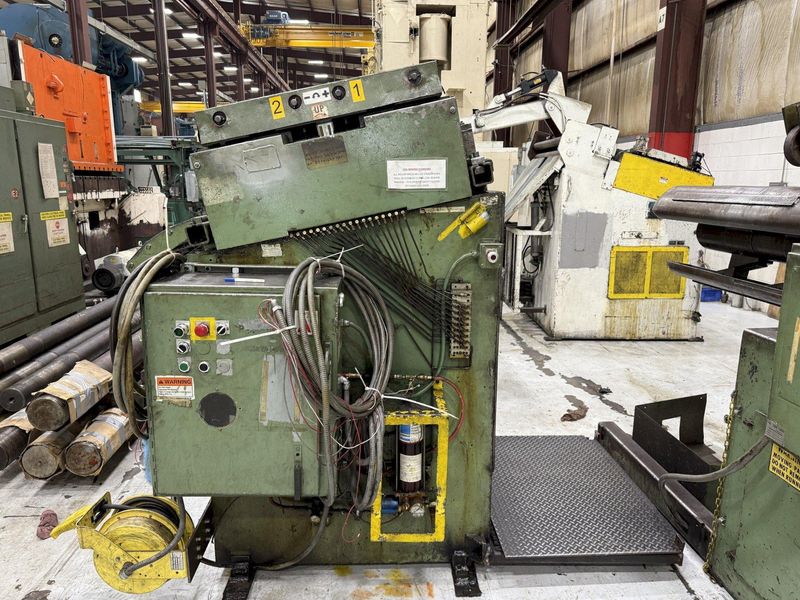 15,000 lbs. x 24" wide Feed Lease Coil Reel with Feed Lease Powered Straightener For Sale - Mode