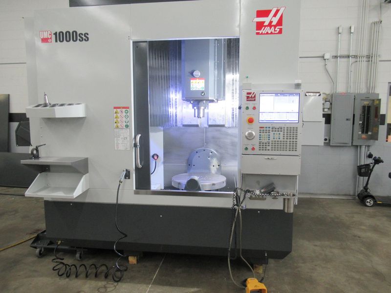 Haas UMC-1000SS CNC 5-Axis Vertical Machining Center, 40"x25"x25", 12K RPM, Chip Con, 30 ATC, Probing, TS Coolant, Air-Vise