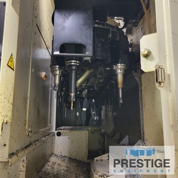 Okuma Genos M560-V, X-41", Y-22", OSP-300M, 32 ATC, Part/Tool Probe, 4th Axis Table, Chip Blaser, 2015, #43983