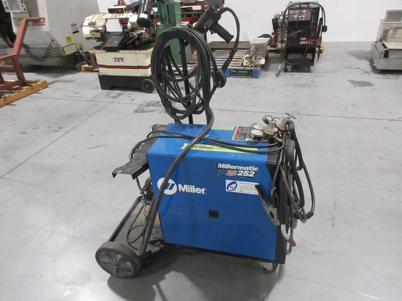 Millermatic 252 MIG Wire Feed Welder with Rolling Base and Accessories, 200/230V Single Phase- Auction Item