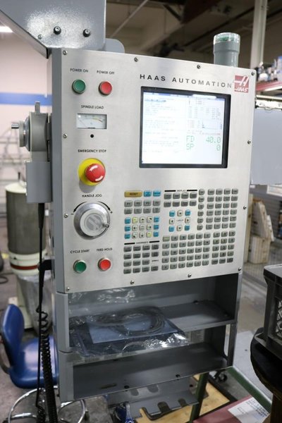 HAAS VF6D/40 VERTICAL MACHINING CENTER, NEW 2006, 15,000 RPM SPINDLE WITH THRU SPINDLE COOLANT