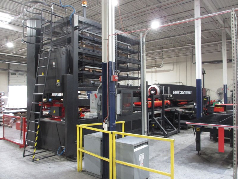 Amada high production punching system with 6 shelf load system and 5 shelf unload with part stacking for unmanned operation with job scheduling