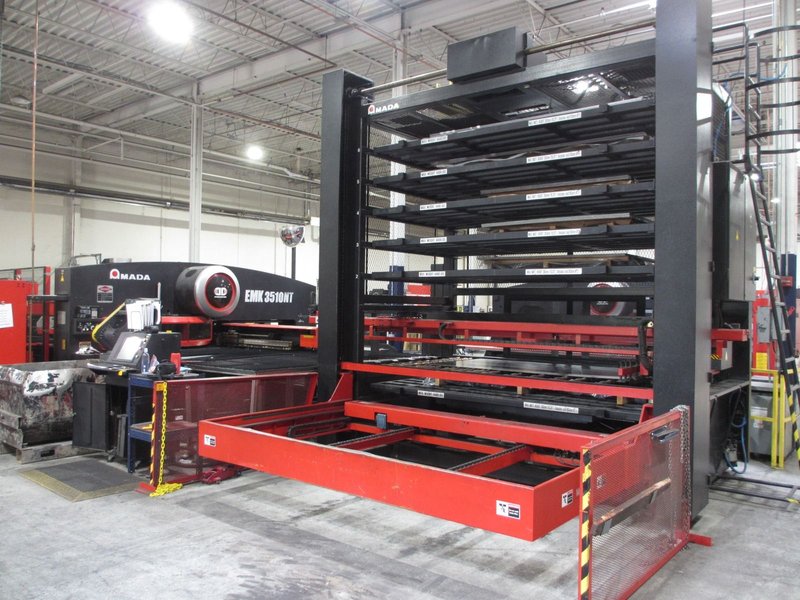 Amada high production punching system with 6 shelf load system and 5 shelf unload with part stacking for unmanned operation with job scheduling