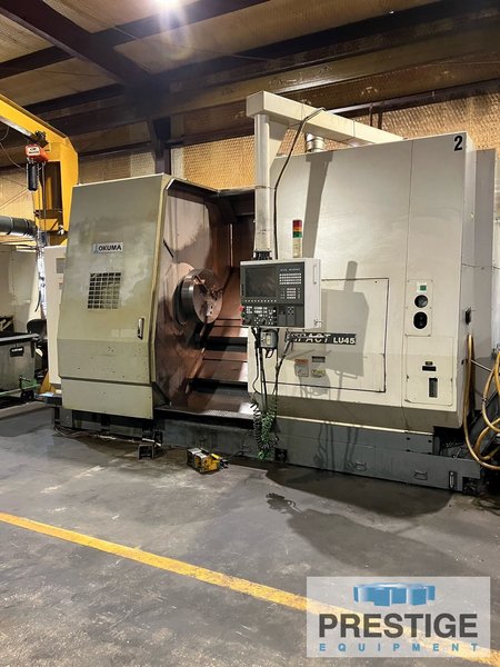 OKUMA Impact LU45 4-Axis, OSP-200L, Upper/Lower Turret, 24" 3-Jaw Chuck, Hyd. Tailstock, Chip Conveyor, Low Hours #32617
