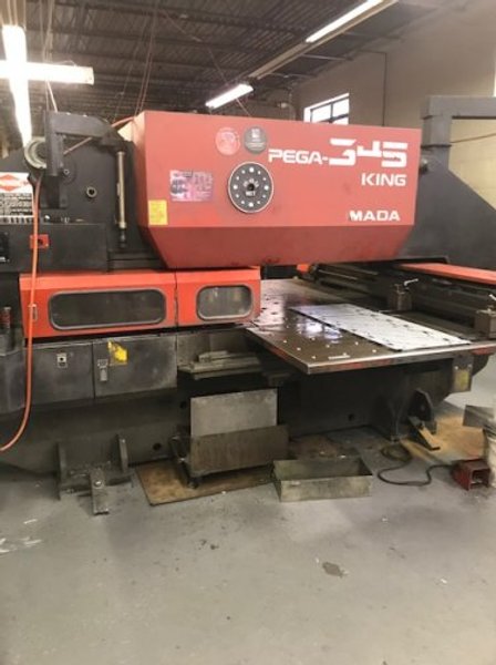 33 TON AMADA PEGA 345 KING TURRET PUNCH
W/ FANUC O4PC CNC CONTROL
MFG 1995